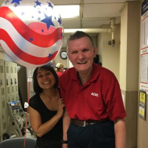 Picture of David with his co-worker, smiling