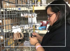 Picture of Vicki sorting jewelry